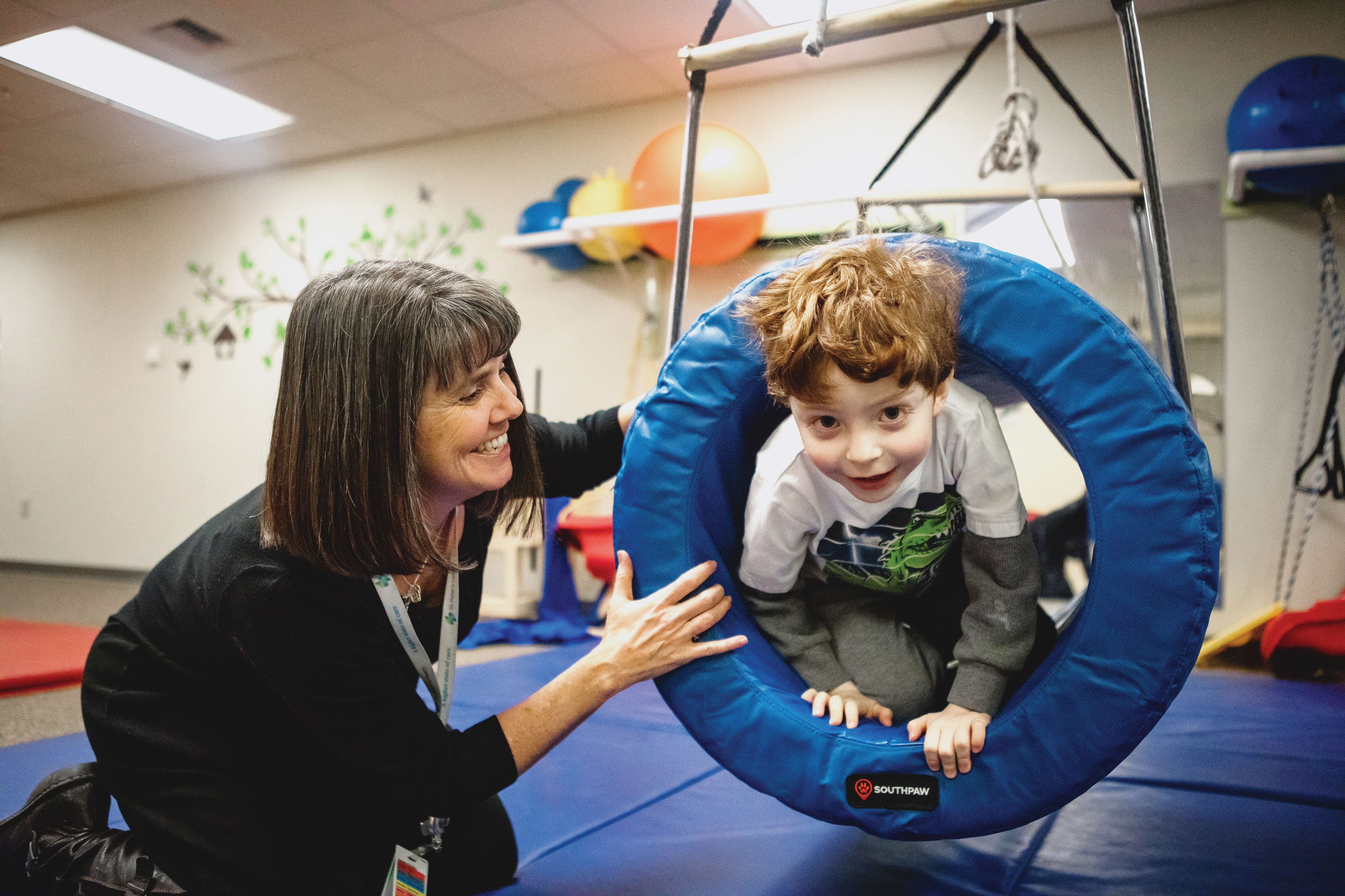 Woman with child patient in SPH Pediatric Rehab